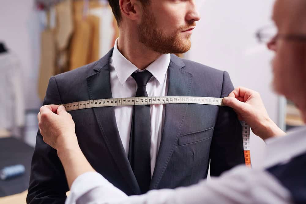 A tailor finishes the bespoke suit process