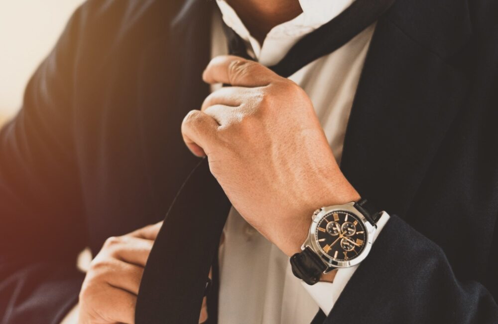 A man fixing his necktie