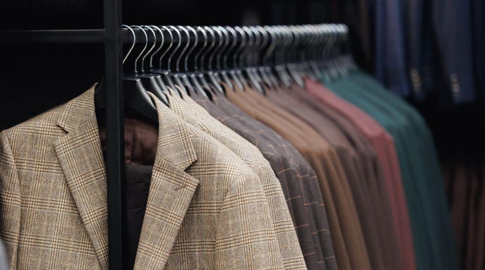 A rack of different colored suits