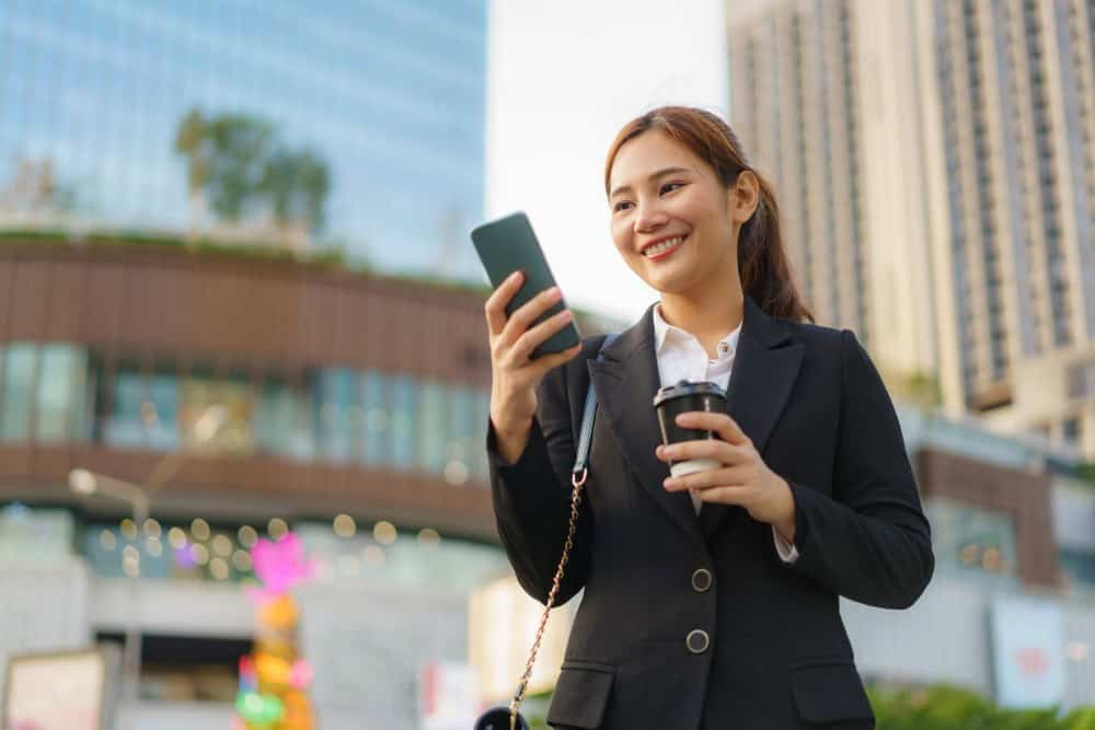 A businesswoman dressed in professional, business-style dress in Bangkok.