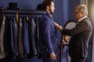 The suit he wears will be in every photo, so the choice matters: readymade or customized suit?