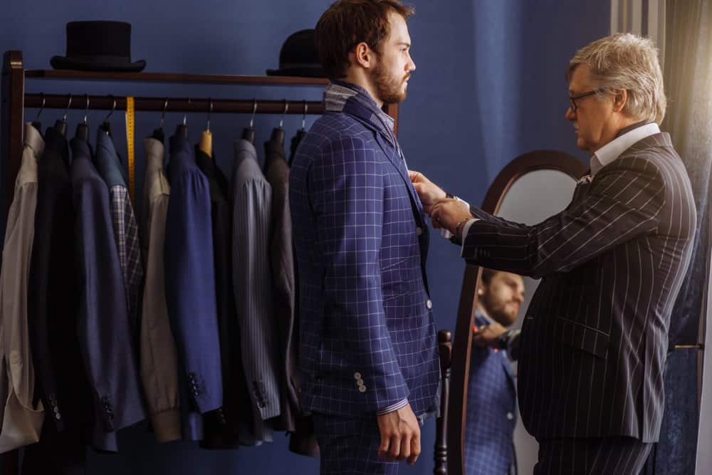 The suit he wears will be in every photo, so the choice matters: readymade or customized suit?
