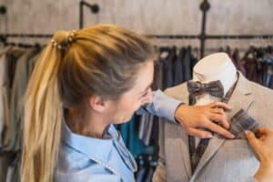 A three-point example of how to fold a pocket square inside a pinstripe suit jacket